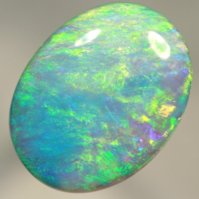 SOLID CRYSTAL OPAL Large opal. 11ct.  Bright green over purple. SEE VIDEO